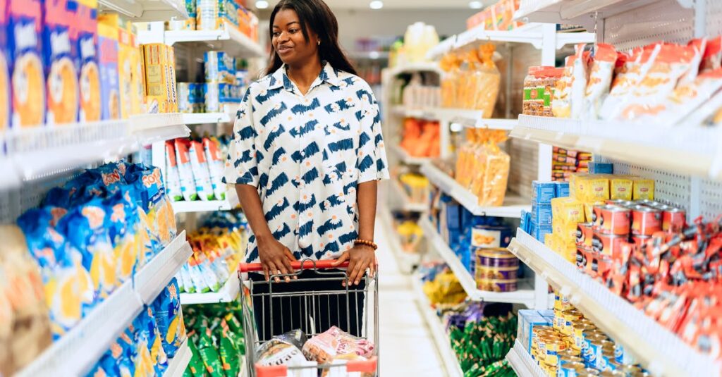 A woman enjoying grocery shopping in a vibrant Lagos supermarket aisle.